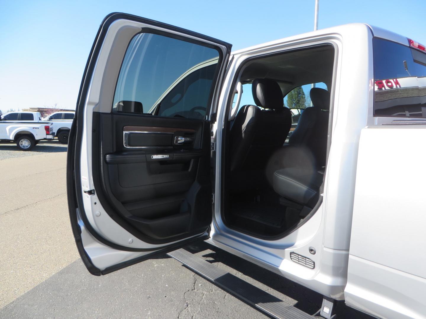 2016 SILVER /BLACK RAM 2500 Laramie Crew Cab SWB 4WD (3C6UR5FL3GG) with an 6.7L L6 OHV 24V TURBO DIESEL engine, 6A transmission, located at 2630 Grass Valley Highway, Auburn, CA, 95603, (530) 508-5100, 38.937893, -121.095482 - Leveled Ram sitting on Fuel Offroad wheels, Falken Wildpeak AT tires, Amp Power steps, Rolling Bed cover, Color matched fender flares, and window tint. - Photo#35